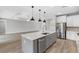 Modern kitchen featuring a center island, stainless steel appliances, and an open floor plan at 6757 Summit View Dr, Brooksville, FL 34601