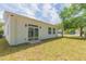 Spacious backyard with a sliding glass door at 723 W 113Th Ave, Tampa, FL 33612