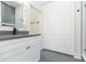 Bathroom with a gray countertop, gray tile floor and double white doors at 723 W 113Th Ave, Tampa, FL 33612