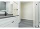 Bathroom featuring a gray countertop, gray tile floor and walk-in closet at 723 W 113Th Ave, Tampa, FL 33612