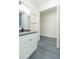 Bathroom featuring a gray countertop, gray tile floor and walk-in closet at 723 W 113Th Ave, Tampa, FL 33612