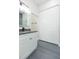 Bathroom with a gray countertop, gray tile floor and double white doors at 723 W 113Th Ave, Tampa, FL 33612