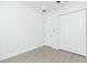 Bright bedroom with a closet, an interior door, light wood floor and neutral walls at 723 W 113Th Ave, Tampa, FL 33612