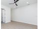 Spacious bedroom featuring a ceiling fan and light-colored wood-look flooring at 723 W 113Th Ave, Tampa, FL 33612