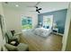 Bright bedroom with a sliding door, a ceiling fan, and stylish lamps at 723 W 113Th Ave, Tampa, FL 33612