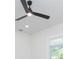 Close up of bedroom with ceiling fan and a window with natural light at 723 W 113Th Ave, Tampa, FL 33612