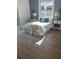 Bright bedroom featuring a large window, stylish lamps, and a cozy bed at 723 W 113Th Ave, Tampa, FL 33612