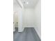Walk-in closet with gray tile floors and bright white trim at 723 W 113Th Ave, Tampa, FL 33612