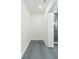Walk-in closet with gray tile floors and bright white trim at 723 W 113Th Ave, Tampa, FL 33612