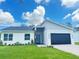 Charming one-story home with a modern design, landscaped front yard, and a two-car garage at 723 W 113Th Ave, Tampa, FL 33612