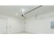 Clean garage with door to inside, garage door opener, and concrete floor at 723 W 113Th Ave, Tampa, FL 33612