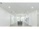 Bright, open kitchen featuring a gray island and modern white cabinetry at 723 W 113Th Ave, Tampa, FL 33612