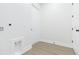Laundry room with white walls, light flooring and washer/dryer hookups at 723 W 113Th Ave, Tampa, FL 33612