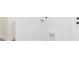 Laundry room with white walls, flooring and washer/dryer hookups at 723 W 113Th Ave, Tampa, FL 33612
