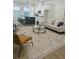 Open-concept living room with modern furnishings and a seamless flow into the adjacent kitchen at 723 W 113Th Ave, Tampa, FL 33612
