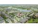 Aerial view of a townhouse community near a lake, showcasing a desirable location at 7325 Parkshore Dr, Apollo Beach, FL 33572