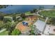 Aerial view of a community park playground with surrounding walkways and a lake at 7325 Parkshore Dr, Apollo Beach, FL 33572