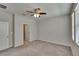 Bright bedroom features neutral walls, carpet flooring, a ceiling fan, and a window at 7325 Parkshore Dr, Apollo Beach, FL 33572