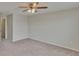 Spacious bedroom with neutral carpet, ceiling fan, and ample natural light at 7325 Parkshore Dr, Apollo Beach, FL 33572