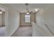 Carpeted bonus room featuring a ceiling fan, window, and access to another room at 7325 Parkshore Dr, Apollo Beach, FL 33572