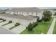 Townhouse complex features manicured landscaping and attached garages at 7325 Parkshore Dr, Apollo Beach, FL 33572