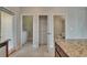 Kitchen view to laundry room, pantry, and powder room; and features granite countertops at 7325 Parkshore Dr, Apollo Beach, FL 33572