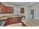 Contemporary kitchen featuring granite countertops and stainless steel appliances at 7325 Parkshore Dr, Apollo Beach, FL 33572
