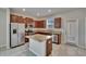 Modern kitchen with granite countertops, stainless steel appliances, and center island at 7325 Parkshore Dr, Apollo Beach, FL 33572