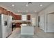 Modern kitchen with granite countertops, stainless steel appliances, and center island at 7325 Parkshore Dr, Apollo Beach, FL 33572