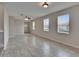 Spacious living room with tile flooring, large windows, and natural light at 7325 Parkshore Dr, Apollo Beach, FL 33572