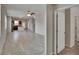 Open-concept living room featuring tile floors and seamless flow into the kitchen at 7325 Parkshore Dr, Apollo Beach, FL 33572