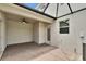 Covered patio with brick flooring, ceiling fan, and a backyard view at 7325 Parkshore Dr, Apollo Beach, FL 33572