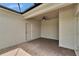 Covered patio with brick flooring, ceiling fan, and outdoor access at 7325 Parkshore Dr, Apollo Beach, FL 33572