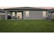 View of the backyard featuring a well-manicured lawn, covered patio, and neutral color palette at 810 Hillshire Pl, Spring Hill, FL 34609