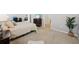 Comfortable bedroom with a television and a large plant at 810 Hillshire Pl, Spring Hill, FL 34609