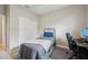 Cozy bedroom with a single bed, a desk, and ample closet space at 810 Hillshire Pl, Spring Hill, FL 34609