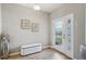 Inviting entryway featuring stylish decor, wood-look tile flooring, and a bright front door at 810 Hillshire Pl, Spring Hill, FL 34609