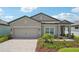 Charming single-Gathering home with a two-car garage and manicured landscaping at 810 Hillshire Pl, Spring Hill, FL 34609
