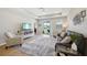 Inviting living room with a large rug, leather couch, and patio access at 810 Hillshire Pl, Spring Hill, FL 34609