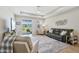 Spacious living room with wood floors and neutral decor at 810 Hillshire Pl, Spring Hill, FL 34609