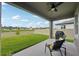 Covered patio with a ceiling fan and a view of the backyard at 810 Hillshire Pl, Spring Hill, FL 34609