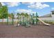 Community playground with multiple play structures and plenty of space for children to explore at 810 Hillshire Pl, Spring Hill, FL 34609