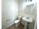Bathroom featuring a pedestal sink, tiled floors, and a framed mirror at 814 19Th Sw St, Largo, FL 33770
