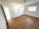 Comfortable bedroom with wood-look flooring, closet, and a ceiling fan at 814 19Th Sw St, Largo, FL 33770