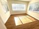 Inviting bedroom with wood-look floors, blinds, and ample natural light at 814 19Th Sw St, Largo, FL 33770