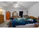 Primary bedroom with ceiling fan, neutral walls, standard closet space, and carpeted floor at 8248 Irene St, Zephyrhills, FL 33540