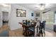 Bright dining room with natural light, featuring a wooden table and multiple chairs at 8248 Irene St, Zephyrhills, FL 33540