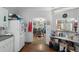 View of the kitchen, adjacent to dining area, showcasing ample storage and counter space at 8248 Irene St, Zephyrhills, FL 33540