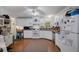 Traditional kitchen with white cabinetry and plenty of counter space for cooking at 8248 Irene St, Zephyrhills, FL 33540