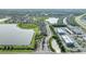 Aerial view of community showcasing lush landscaping, lakes, and winding roads at 9140 Hillcroft Dr, Riverview, FL 33578